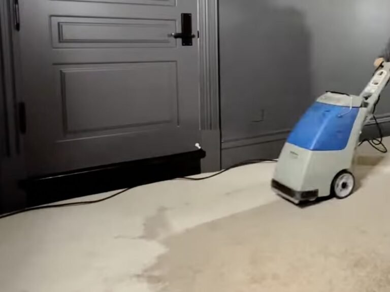 Wet carpet extraction in a Ruskin, FL bedroom: water being pulled from soaked carpet after a leak, before mold can set in